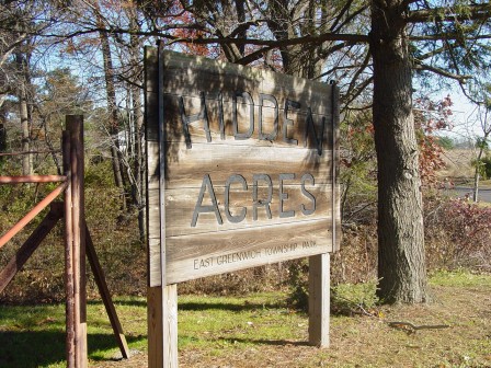 Hidden Acres Park sign